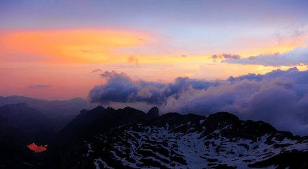 Sunset in the clouds in the mountains of the Caucasus, Russiaの写真素材