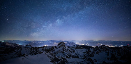 Milky Way over the mountains at night. Panoramic view