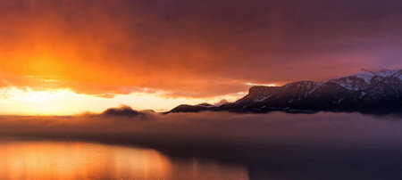 Beautiful sunrise over the fjord and mountains in Norway.の写真素材