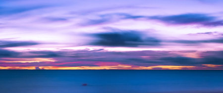 Panoramic view of the sea and sky at sunset. Long exposureの写真素材