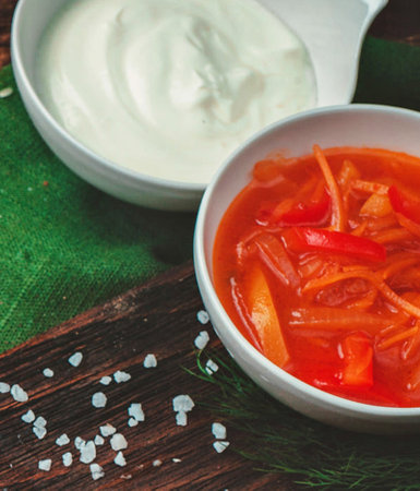 Traditional Ukrainian and Russian borscht with sour cream and red pepperの写真素材