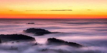 Beautiful sunrise over the sea of fog in Phu Kradueng National Park, Loei, Thailandの写真素材