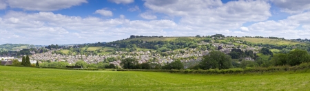 Idyllic rural view of gently rolling patchwork farmland and villages with pretty wooded boundaries, in the beautiful surroundings of the Cotswolds, England, UK.の写真素材