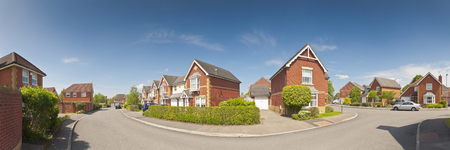 Pretty newly built homes and gardens against a clear blue summers sky  Stitched panoramic image detailed when viewed large の写真素材