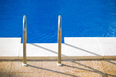 Cool poolside shades with sleek holiday villas reflected in the lenses.