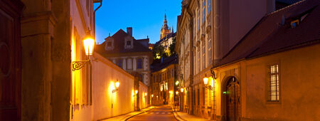 Street view of St Vitus Cathedral (1714) illuminated at night in the magical city of Prague.の写真素材