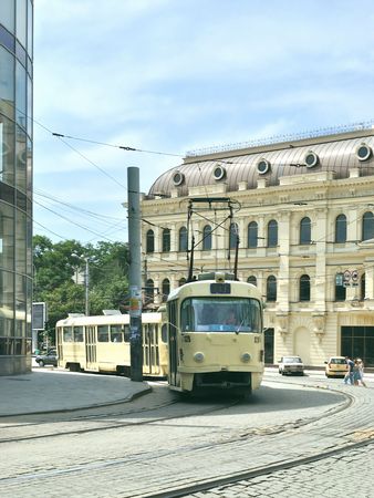 The tram at the street in the old part of modern cityのeditorial素材