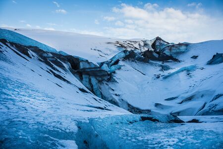 Iceland glacier Myrdalsjokull landscape blue ice with volcanic ash