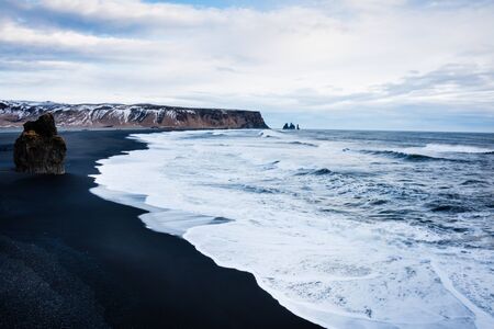 Iceland Vik coast in winter with black volcanic sand beach and the shoreの写真素材