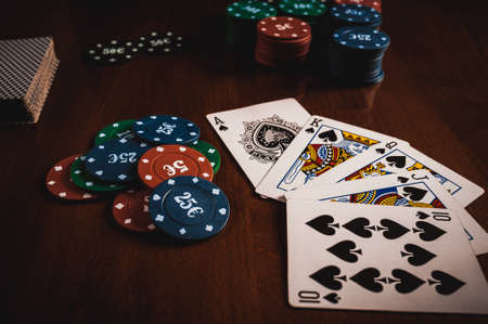 Person showing her deck at the poker gameの写真素材