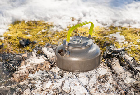 kettle is burning at the stake outdoors, winterの写真素材