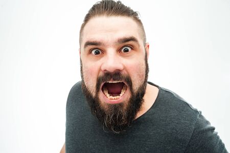 Closeup portrait of angry, mad, annoyed, skeptical, grumpy man, employee, worker isolated on white...