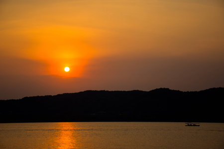 West Lake sunset silhouetteの写真素材