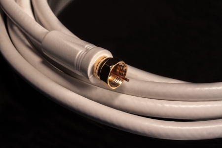 white Coax cable for satelite, cable video audio connectionsの写真素材