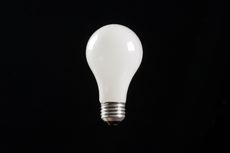 incandescent light buld with a black backgroundの写真素材