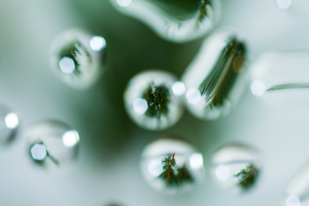 abstract water dropdesign against a distorted bokeh backgroundの写真素材