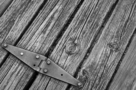 Old rusted hinge holding floating wooden dock togetherの写真素材