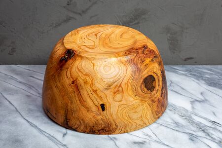 Cherry wood bowl with figured grain next to a burlの写真素材