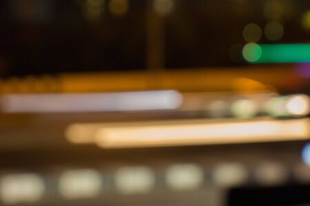 Heavy traffic in a blurred photo out of focus showing heavy traffic along the highway in late evening in the metropolis.の写真素材