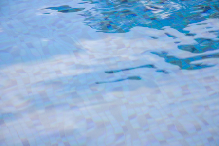 Blurred peaceful pool reflection for business concept or perception of religion.  The future is uncertain but the ripples of the water are relaxing and bring good perspective on life.の写真素材