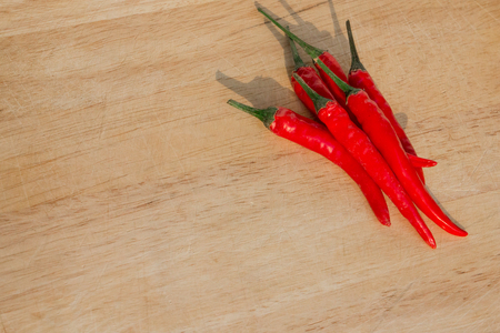Pile of chillies ready to be sliced and diced to create a delectable dish that will be truly unforgettable.  Spicy recipe item your guests will devour.  Copyspace.の写真素材
