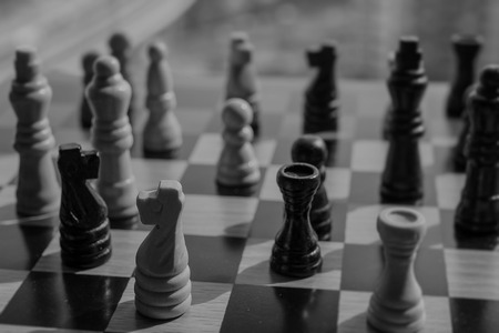 Dark and dreadful chess battle expecting to lose and suffer a bitter defeat against the victor.  Copy space.の写真素材