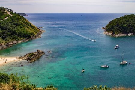 Boat rental in phuket thailand, rental agency in Bangkok Thailand.  Diving in tropical reefs.  Explore by land and sea and dive to see coral and fish.  Copyspace.の写真素材