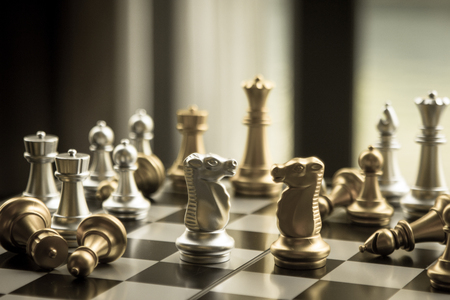 Old fashioned game of chess with strategic gunslinger battle of fight for the victory.  Fight and beat and punish the competition until you find the path to success.  Copy space.の写真素材