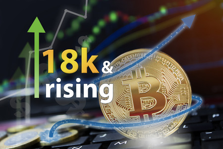 Bitcoin exchange seeing rising values of cryptocurrency and increased profits for investors.の写真素材