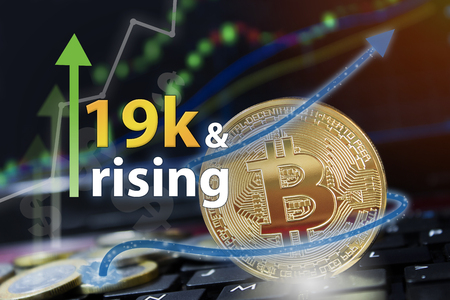 Bitcoin exchange seeing rising values of cryptocurrency and increased profits for investors.の写真素材