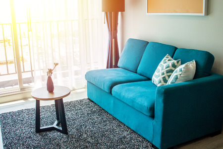 Living room home design for contemporary layout and blue couch with good balance for relaxation and living well.の写真素材