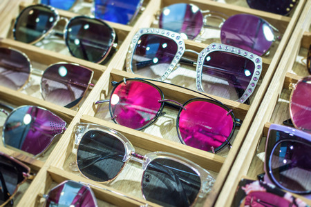 Sunglass shop and different apparel for eyes with colorful accessories and trendy lenses.の写真素材