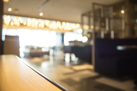 Blurred interior design with bright white lighting and hanging lights in cafe or restaurant.の写真素材