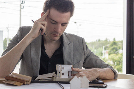 Business man depressed with headache.  Architect.