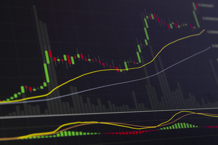 Stock market investment graph in dark tones with candle sticks.