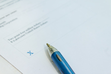 Financial paperwork for signature concept on blank white paper.  Empty document to sign.の写真素材