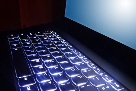 Business laptop hands on keyboard for financial concept.の写真素材