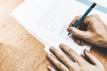 Rental contract agreement for review and signing.  Signing a lease or rental contract.