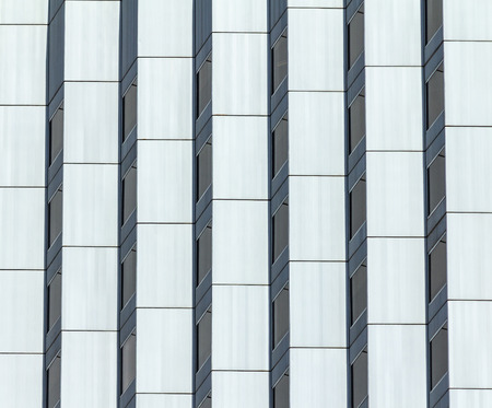 modern architecture building facade in glass and concreteの写真素材