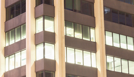 Big business with skyscraper office buildings at night.  Office complexes and corporate structure.の写真素材