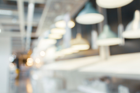 Light fixtures and bulbs in blurred shot at home department store.  Abstract hangings on wall.の写真素材