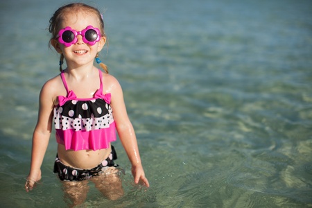 Adorable little girl on tropical beach vacationの写真素材