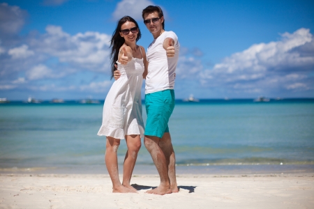 Young couple enjoying each other on a beachの写真素材