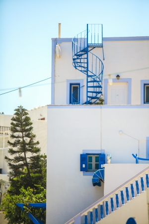 Traditional Greek house with blue spiral staircase in Firostefani Greeceの写真素材