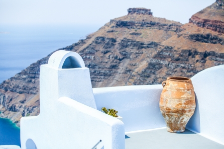 Ceramic vase on the balcony background of cliff Scaros in Imerovigli, Santoriniの写真素材