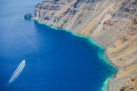 boat in a lagoon on the island of Santorini,Greeceの写真素材