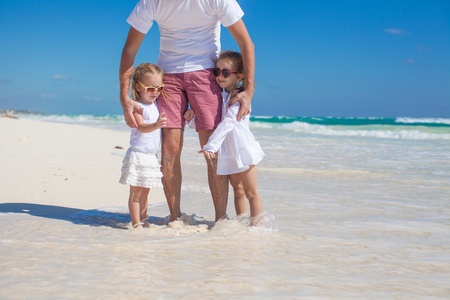Happy father and his adorable little daughter at tropical beachの写真素材