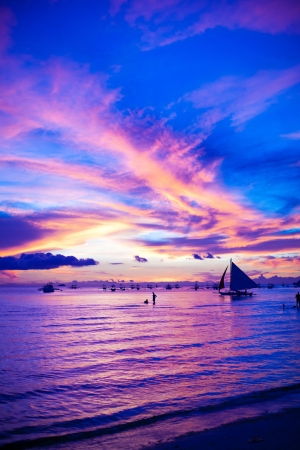 Sailing boat in awesome sunset in Boracay island on Philippinesの写真素材
