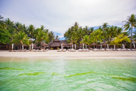Tropical white sunny beach in beautiful exotic resortの写真素材
