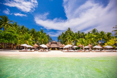 Tropical white sunny beach in beautiful exotic resortの写真素材